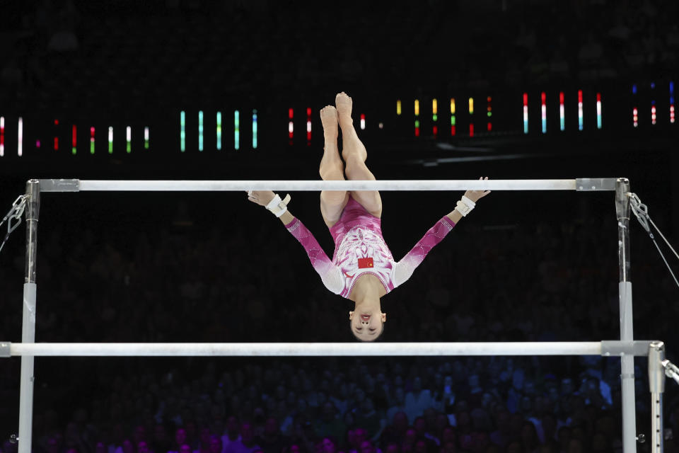 Gold medallist China's Qiu Qiyuan competes on the uneven bars during the apparatus finals at the Artistic Gymnastics World Championships in Antwerp, Belgium, Saturday, Oct. 7, 2023. (AP Photo/Geert vanden Wijngaert)