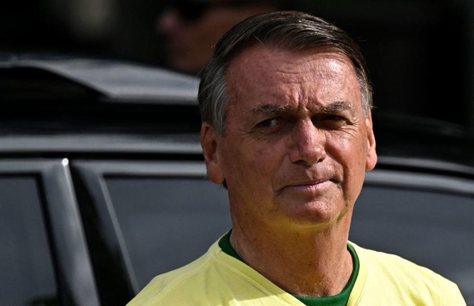 Brazilian President and re-election candidate Jair Bolsonaro arrives to vote at a polling station in Rio de Janeiro, Brazil, on Oct. 30, 2022, during the presidential run-off election.<span class="copyright">Mauro Pimentel—AFP/Getty Images</span>