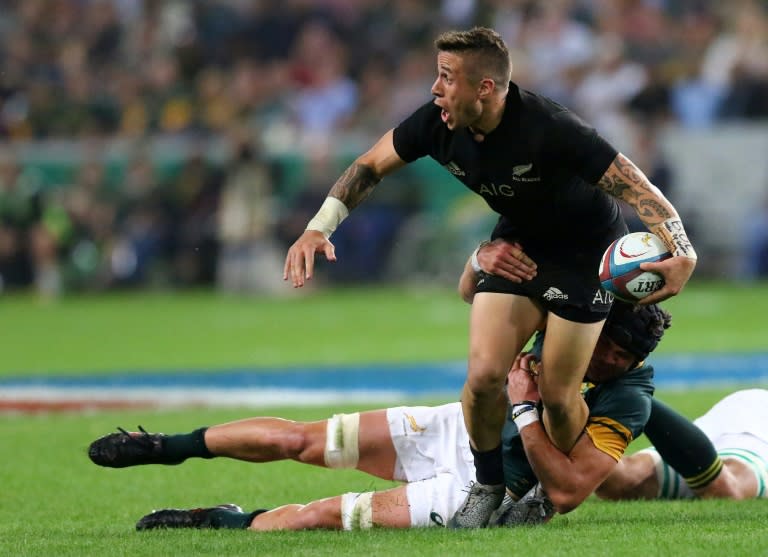 South Africa's Warren Whiteley (Bottom) tackles All Blacks TJ Perenara during the Rugby Championship match between South Africa and New Zealand at Kingspark Rugby stadium in Durban