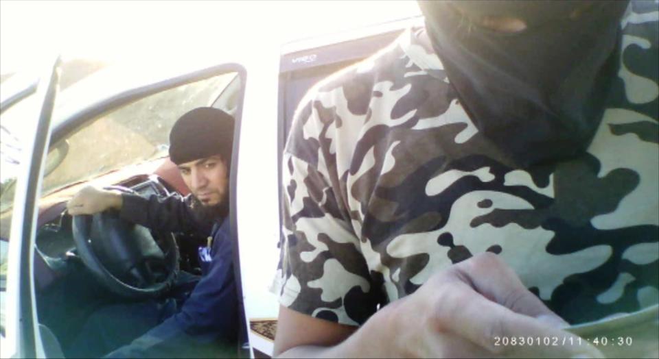 Secret filming captures an activist being questioned at a ISIS checkpoint near Raqqa in Syria.