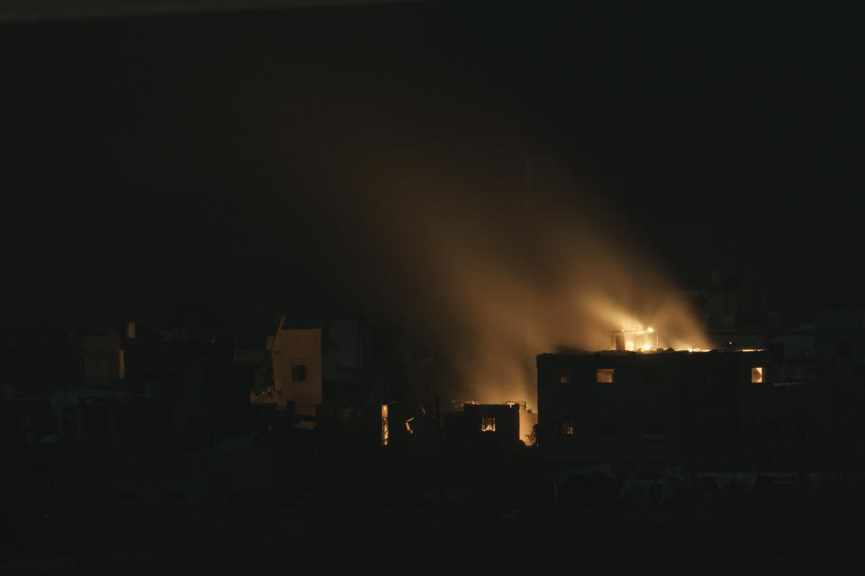 Flames engulf a building following an Israeli airstrike in the Gaza Strip, as seen from southern Israel, Thursday, Nov. 23, 2023. (AP Photo/Leo Correa)