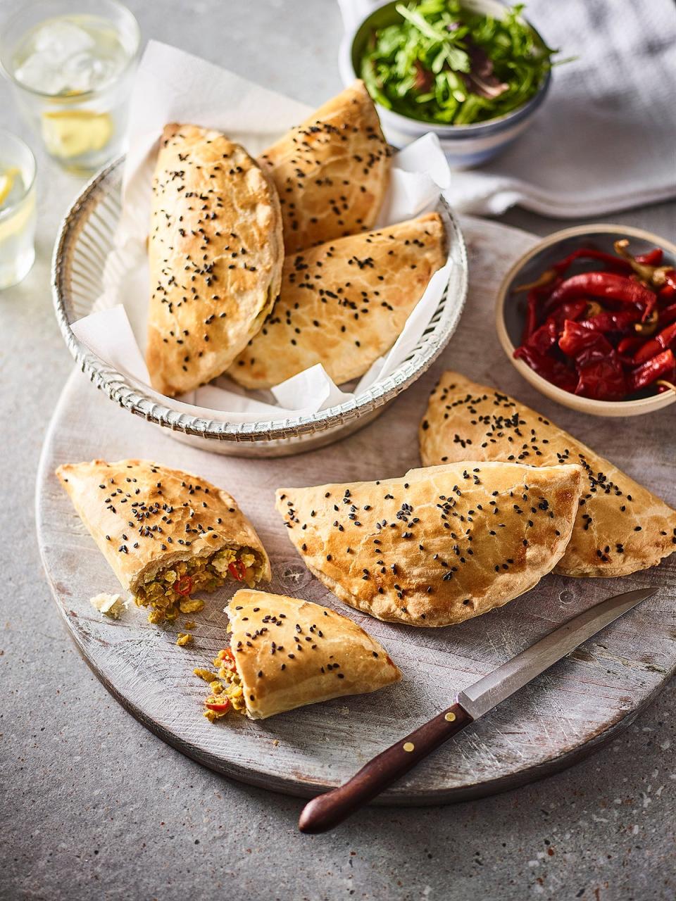 Add a touch of spice to your supper with these golden pasties filled with creamy feta and fragrant curry (Cooks & Co)