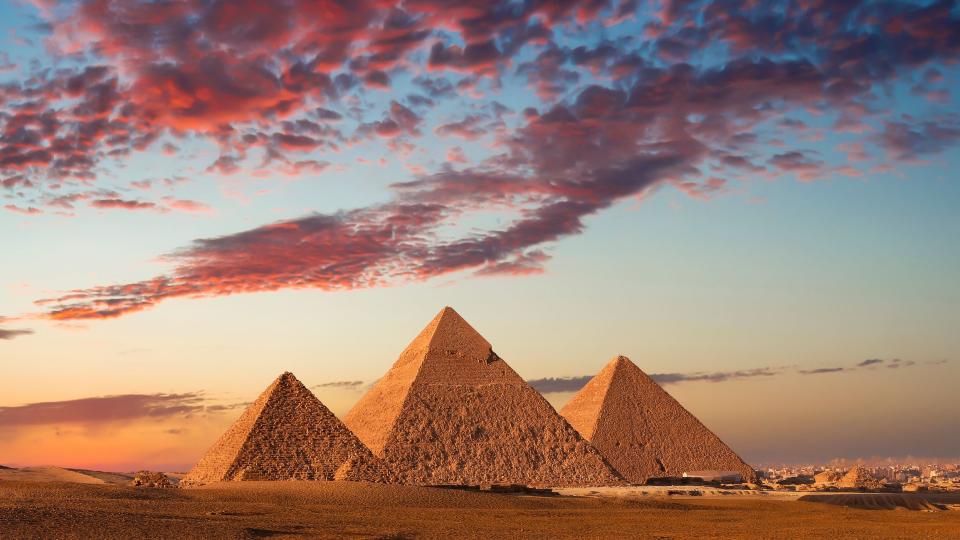 <p>The Great Pyramids of Giza are one of the world's seven ancient wonders. Amid the arid Egyptian desert stands a complex of massive pyramids that once <a href="https://www.britannica.com/topic/Pyramids-of-Giza" rel="nofollow noopener" target="_blank" data-ylk="slk:served as the tombs;elm:context_link;itc:0;sec:content-canvas" class="link ">served as the tombs</a> for powerful rulers of the 4th dynasty (c. 2575–c. 2465 BCE) - King Khufu, King Khafre, and King Menkaure. The mysterious landmarks are mighty architectural achievements that capture the attention of millions of visitors each year, and as the oldest standing monuments in the world, it's no wonder why. Embark on a virtual journey to Egypt and discover these facts about the Great Pyramids of Giza.</p>