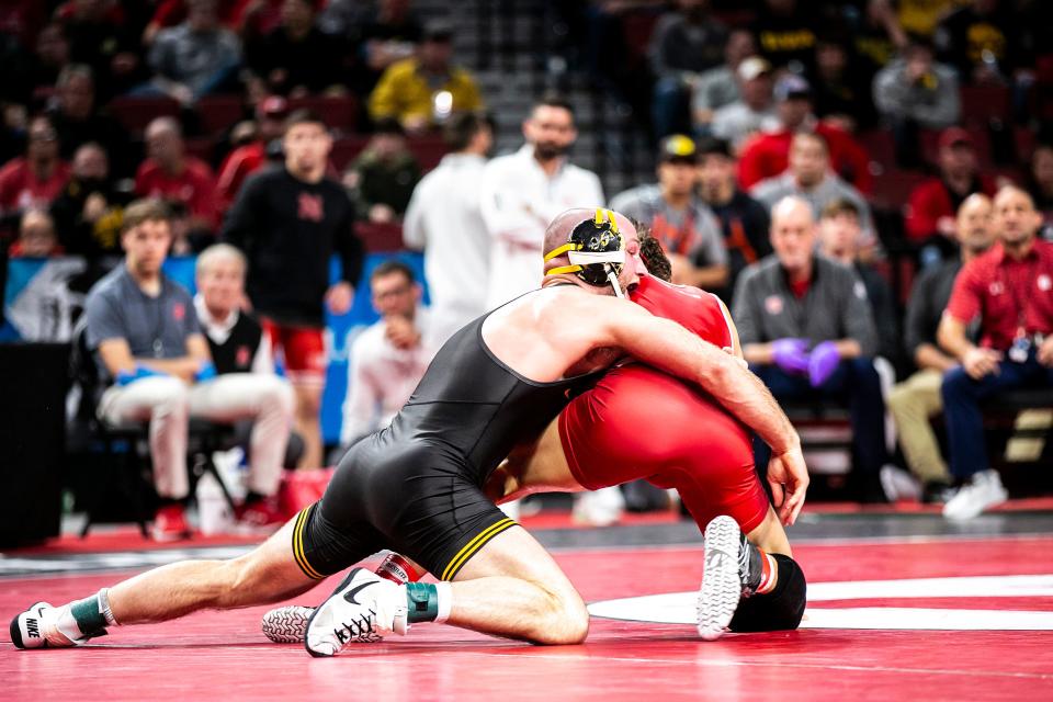 Iowa's Alex Marinelli, left, wrestles Wisconsin's Dean Hamiti at 165 pounds during the second session of the Big Ten Wrestling Championships, Saturday, March 5, 2022, at Pinnacle Bank Arena in Lincoln, Nebraska.