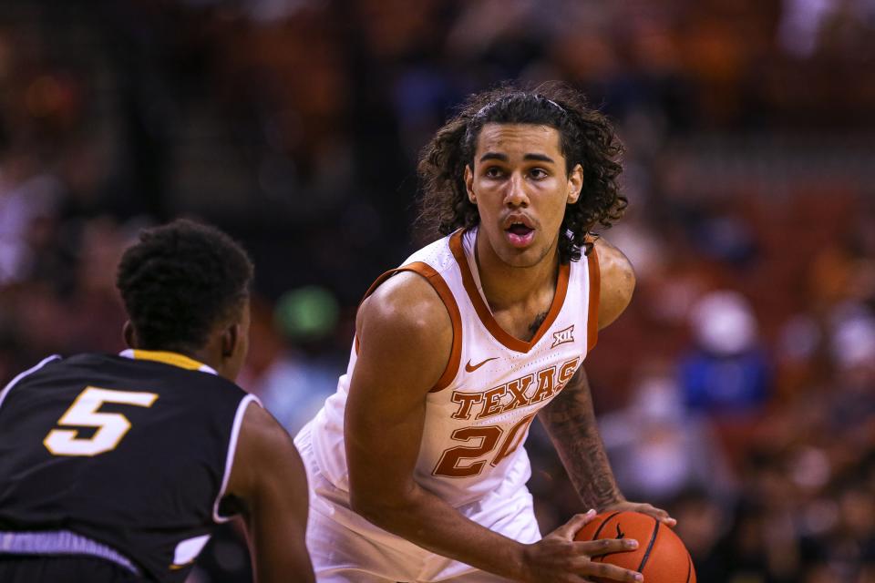 Texas guard Jaylon Tyson (20) looks for an open teammate during an exhibition game between Texas and Texas Lutheran at the Frank Erwin Center in Austin, Texas on Nov. 1, 2021. Texas defeated Texas Lutheran 96-33.