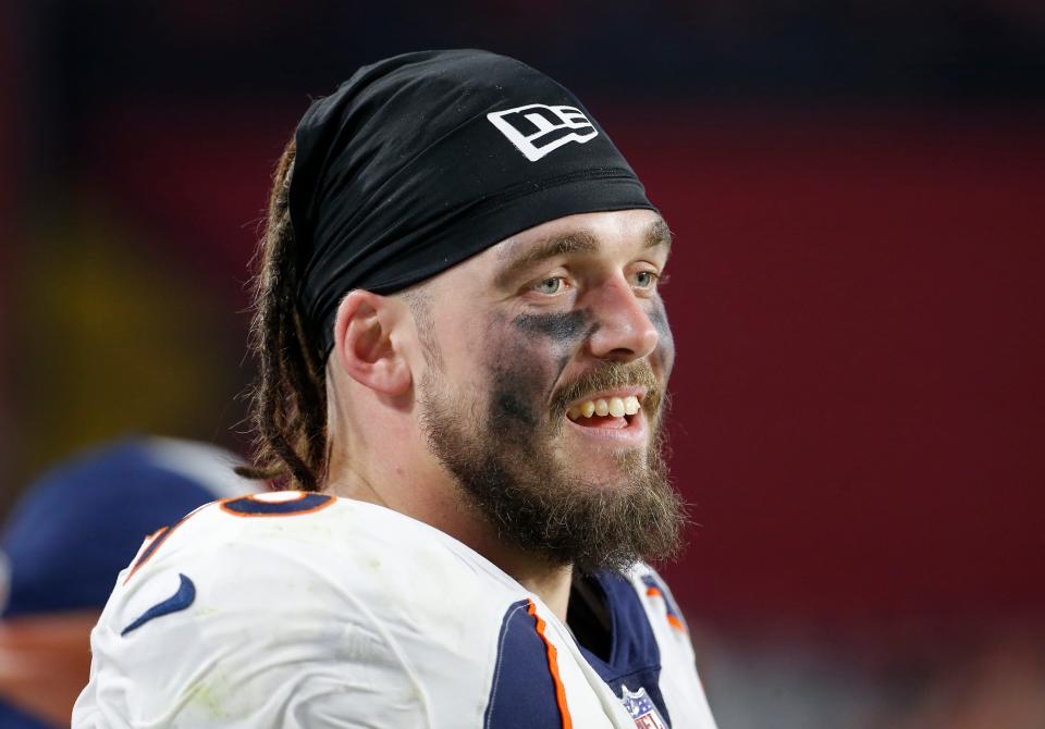 FILE - In this Oct. 18, 2018, file photo, Denver Broncos defensive end Derek Wolfe looks on during an NFL football game against the Arizona Cardinals in Glendale, Ariz.