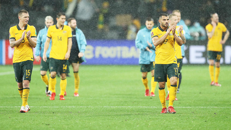 Socceroos players, pictured here applauding fans after their 0-0 draw with Saudi Arabia.