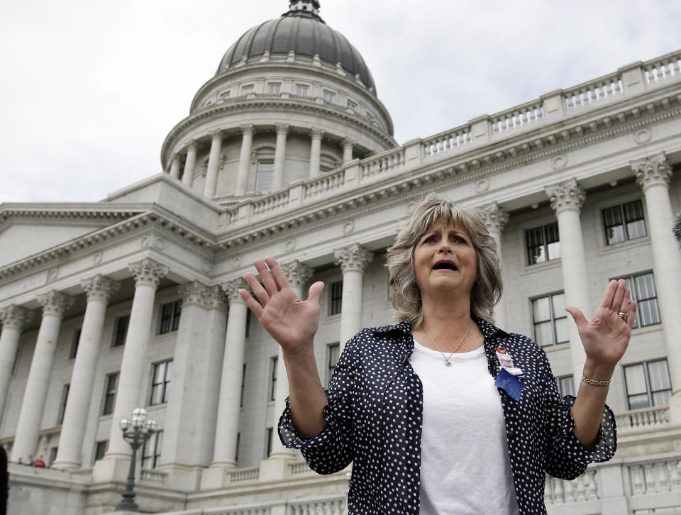 FILE - This Saturday, March 5, 2016, file photo, Jeanette Finicum speaks with reporters during a rally at the Utah State Capitol, in Salt Lake City. Finicum, the widow of an Arizona rancher LaVoy Finicum, killed by FBI agents in a Jan. 26, 2016, traffic stop in central Oregon, is planning to hold a meeting in John Day, Ore., Jan. 28, 2017, with their children, in an effort to continue with his mission. (AP Photo/Rick Bowmer, file)
