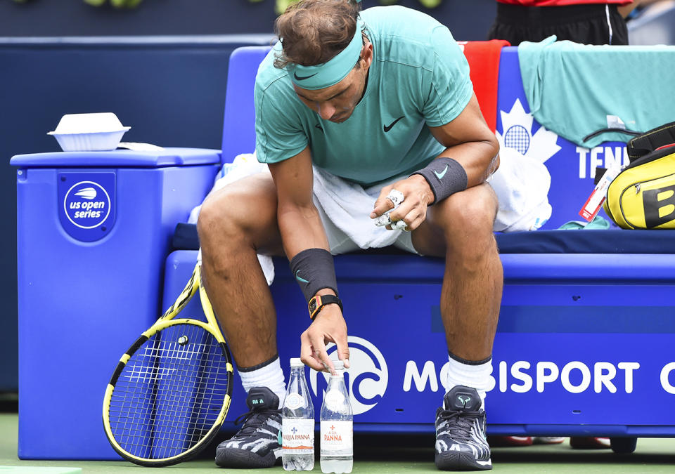 Rafael Nadal, pictured here obsessing about his water bottles in 2019.