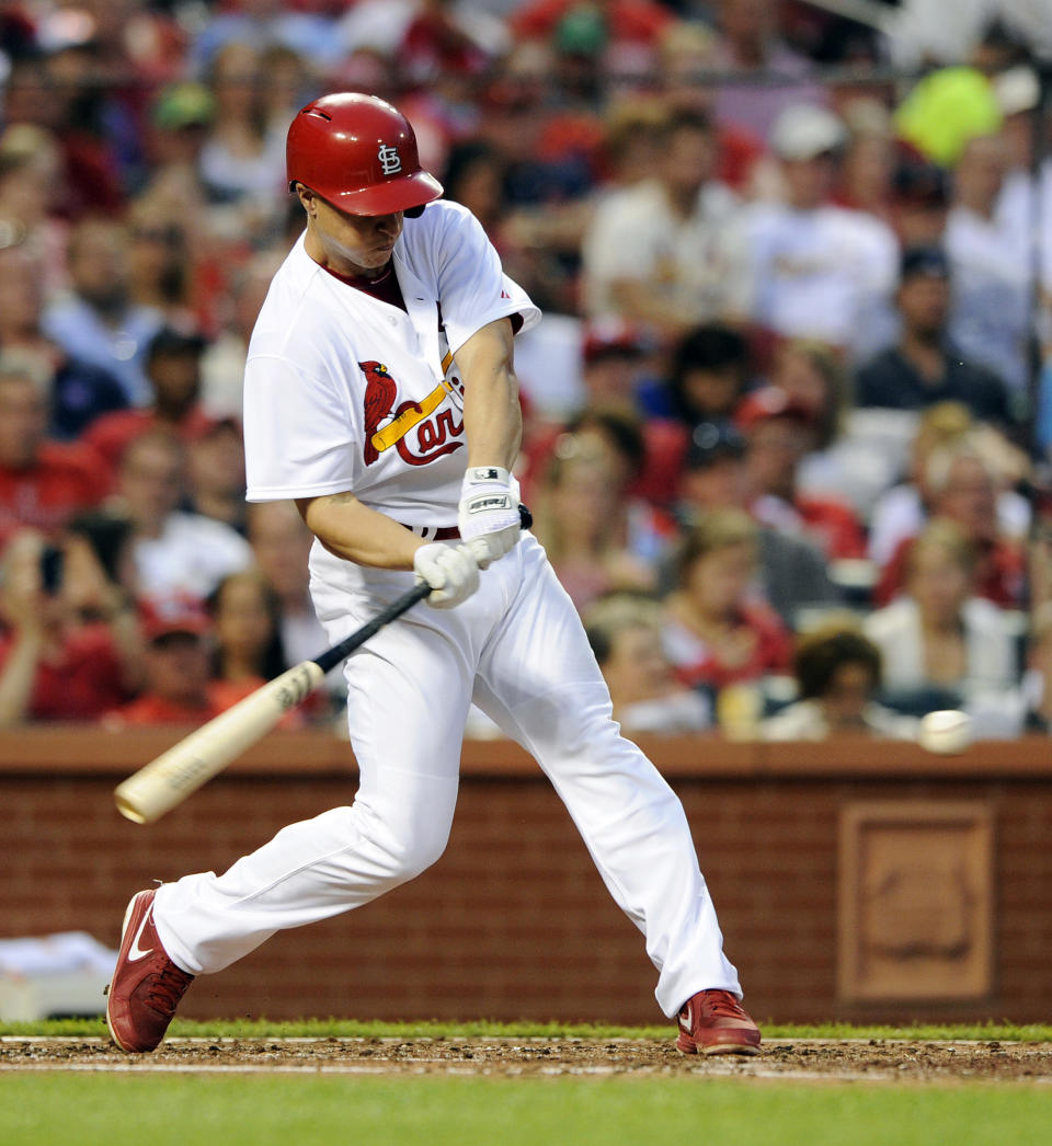 St. Louis Cardinals' Mark Ellis hits a two-run single against the Chicago Cubs in the second inning in a baseball game, Monday, May 12, 2014, at Busch Stadium in St. Louis. (AP Photo/Bill Boyce)