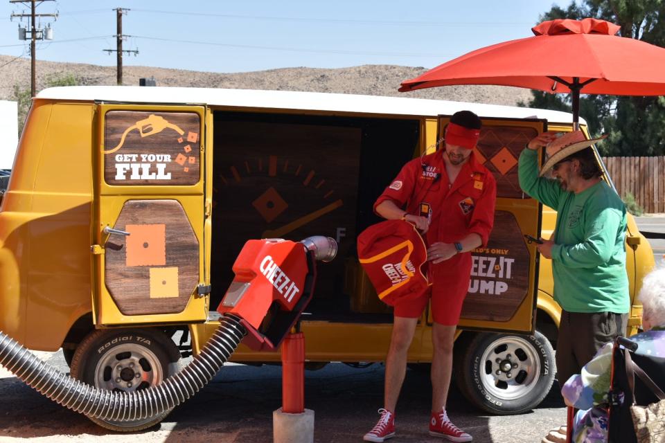 Wonder Valley resident Evan Brosowsky and a Cheez-it brand ambassador at the Cheez-it pump.