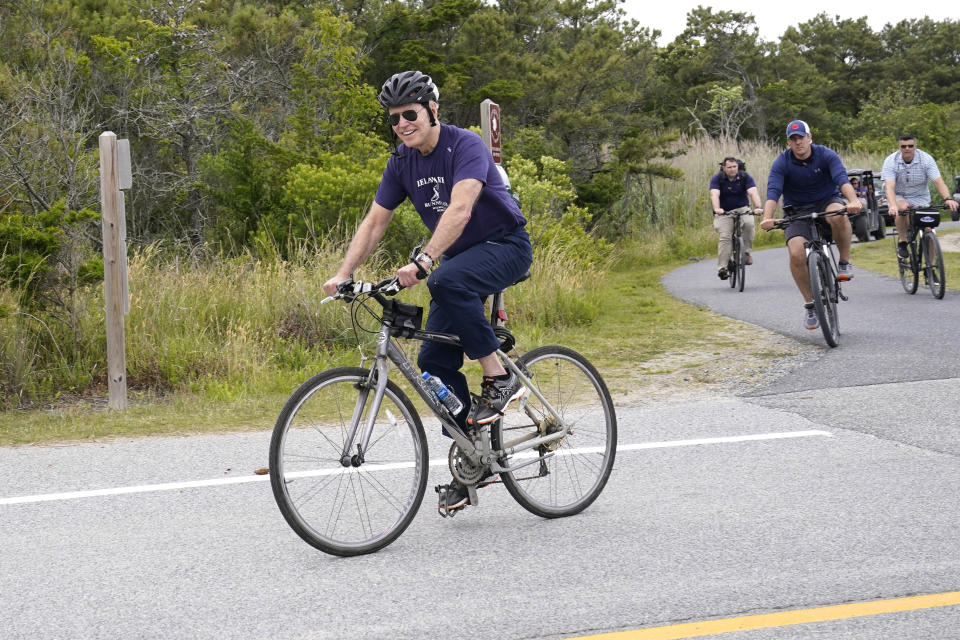President Joe Biden, with first lady Jill Biden, not shown, takes a bike ride in Rehoboth Beach, Del., Thursday, June 3, 2021. The Biden's are spending a few days in Rehoboth Beach to celebrate first lady Jill Biden's 70th birthday. (AP Photo/Susan Walsh)