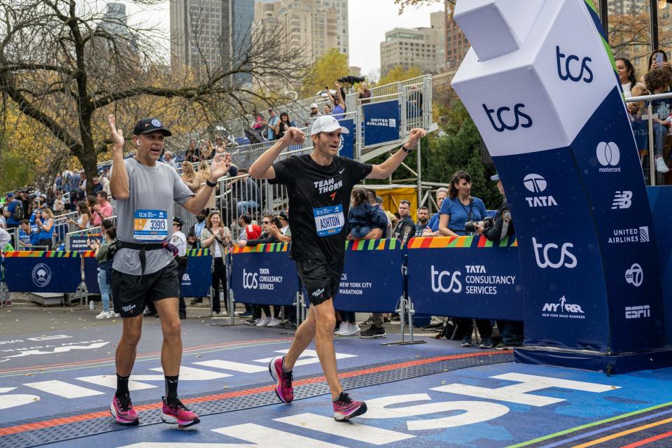 November 6, 2022:  Ashton Kutcher crosses the finish line at the New York City Marathon.