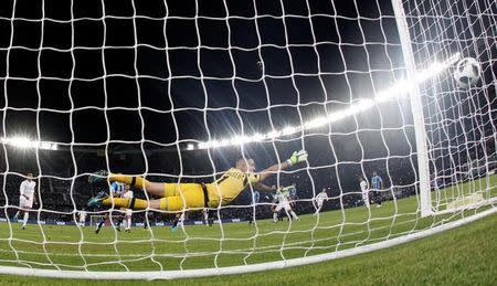 Soccer Football - FIFA Club World Cup Final - Real Madrid vs Gremio FBPA - Zayed Sports City Stadium, Abu Dhabi, United Arab Emirates - December 16, 2017 Real Madrid’s Cristiano Ronaldo scores their first goal from a free kick REUTERS/Amr Abdallah Dalsh