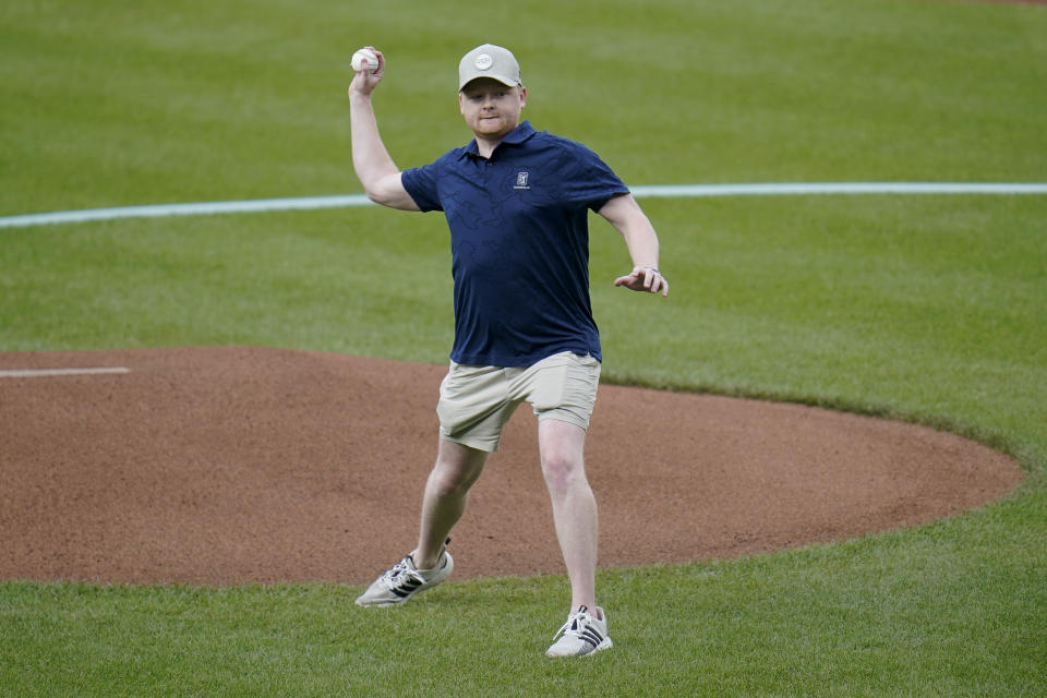 Hayden Poole, son of former Baltimore Orioles pitcher Jim Poole, throws a ceremonial pitch prior to a baseball game between the Orioles and the Seattle Mariners, Thursday, June 2, 2022, in Baltimore. The Orioles honored Lou Gehrig Day on Thursday. (AP Photo/Julio Cortez)