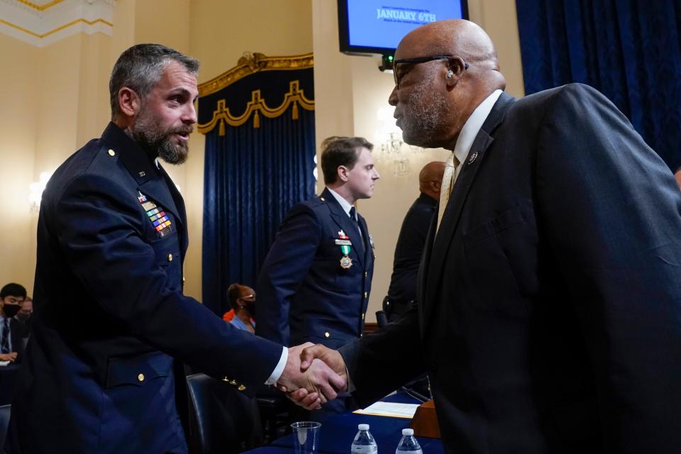 Rep. Bennie Thompson, D-Miss., greets Washington Metropolitan Police Department officer Michael Fanone before the House select committee hearing on the Jan. 6 attack on the Capitol. Thompson is chair of the panel.