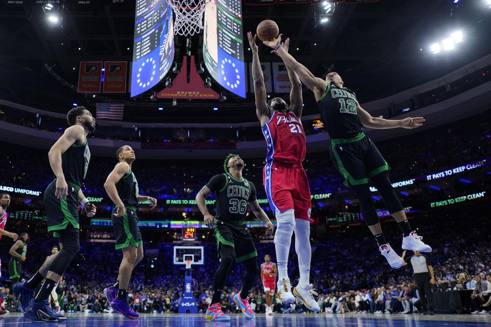 Philadelphia 76ers star and newly minted NBA MVP Joel Embiid is surrounded by four Boston Celtics during the second half of Game 3 in the Eastern Conference semifinals. (AP Photo/Matt Slocum)