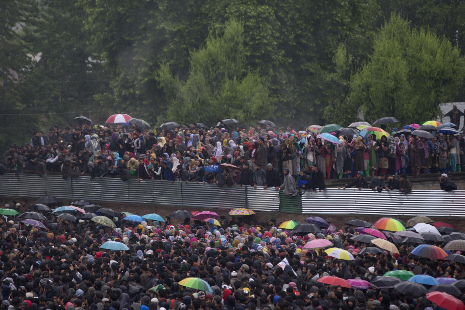 Kashmiri villagers participate in the funeral procession of Zakir Musa, a top militant commander linked to al-Qaida, as it rains in Tral, south of Srinagar, Indian controlled Kashmir, Friday, May 24, 2019. Musa was killed Thursday evening in a gunfight after police and soldiers launched a counterinsurgency operation in the southern Tral area, said Col. Rajesh Kalia, an Indian army spokesman. (AP Photo/Dar Yasin)