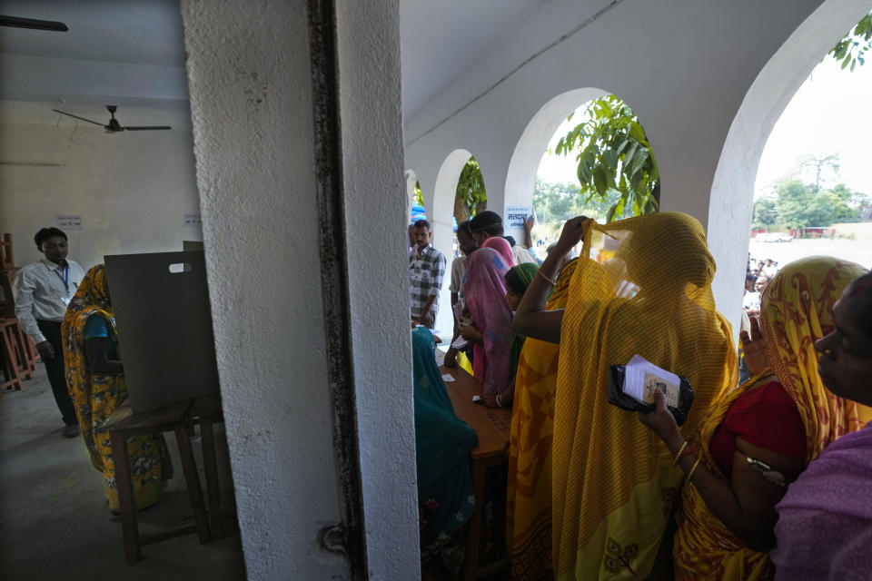 Women stand in a queue to cast their votes during the fourth phase of general election, on the outskirts of Samastipur, in the Indian state of Bihar, Monday, May 13, 2024. (AP Photo/Manish Swarup)