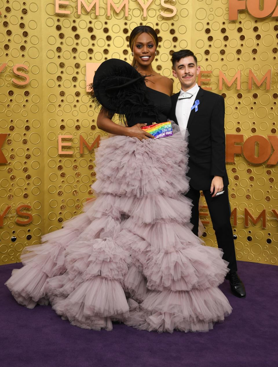 US actress Laverne Cox and Chase Strangio arrive for the 71st Emmy Awards at the Microsoft Theatre in Los Angeles on September 22, 2019. (Photo by VALERIE MACON / AFP)        (Photo credit should read VALERIE MACON/AFP/Getty Images)