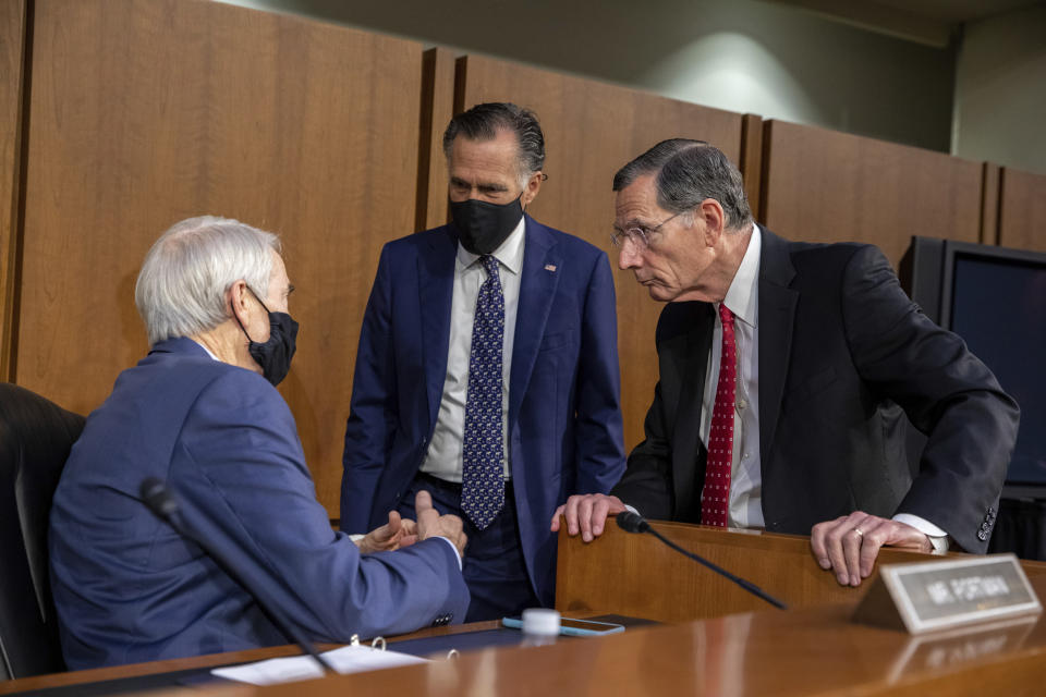 From left, Sen. Rob Portman, R-Ohio, Sen. Mitt Romney, R-Utah, and Sen. John Barrasso, R-Wyo., speak before a Senate Foreign Relations Committee meeting on Capitol Hill in Washington, Wednesday, Aug. 4, 2021. (AP Photo/Amanda Andrade-Rhoades)