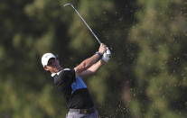 Rory McIlroy of Northern Ireland plays a shot on the 16th hole during the third round of the DP World Tour Championship golf tournament in Dubai, United Arab Emirates, Saturday, Nov. 23, 2019. (AP Photo/Kamran Jebreili)