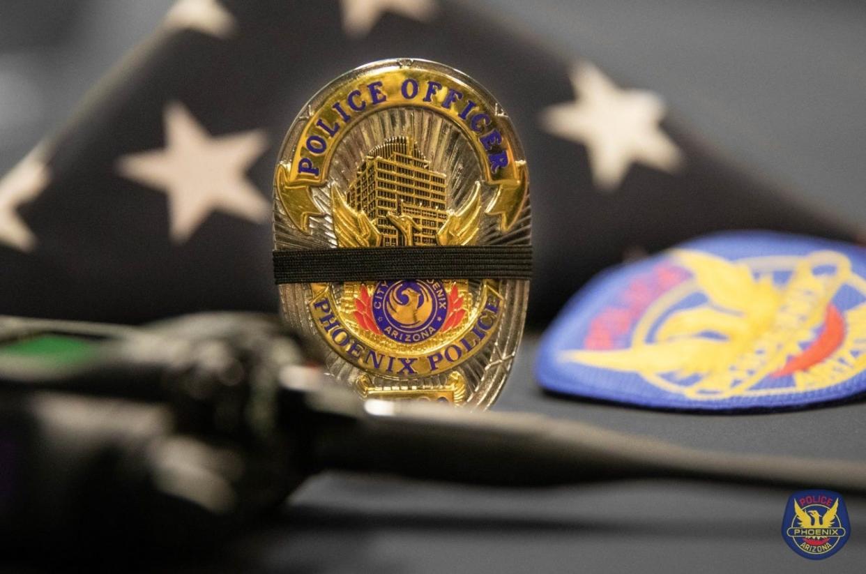 Pictured is a Phoenix Police Department badge.