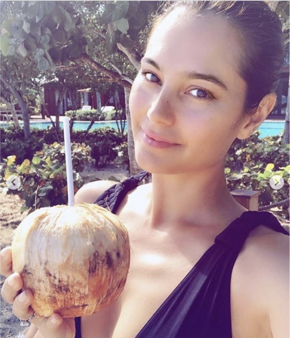 Moore shared a photo of Willis looking relaxed and drinking out of a coconut at the beach in honor of International Women's Day. (Demi Moore / Instagram)