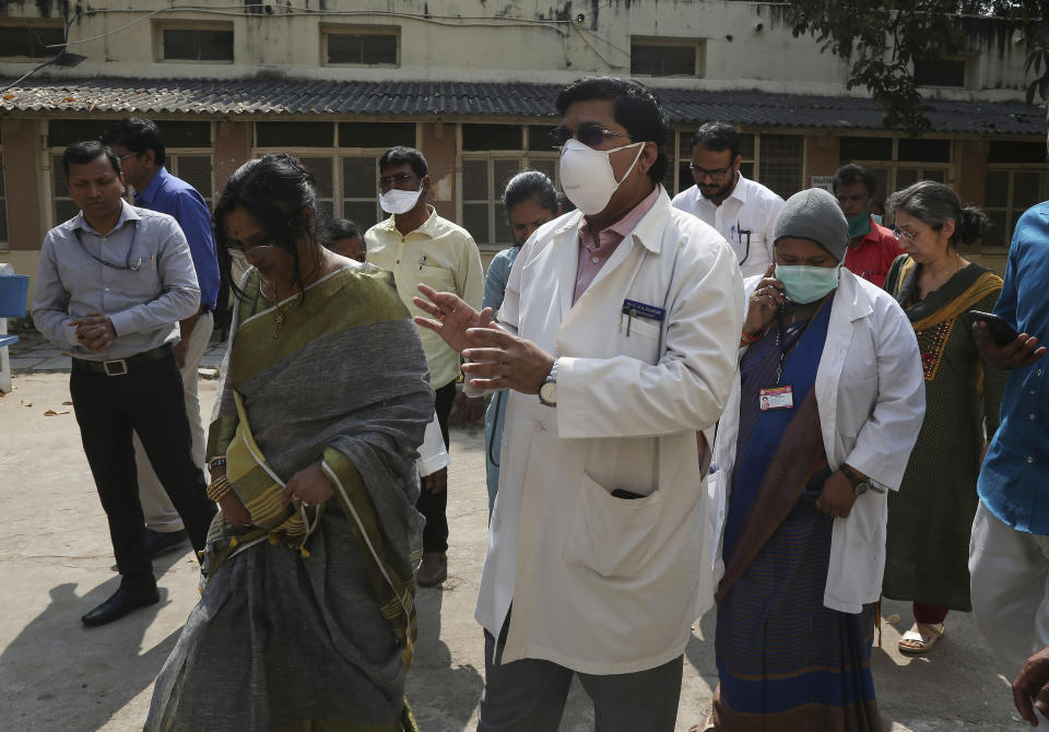 A team of experts from Indian health ministry visit an isolation ward for people who returned from China and under observation at the Government Fever Hospital in Hyderabad, India, Tuesday, Jan. 28, 2020. Countries with citizens in the central Chinese city that's the epicenter of a viral outbreak are planning evacuations as the number of illnesses grow and China takes drastic measures to try to stop the spread of the virus. (AP Photo/Mahesh Kumar A.)