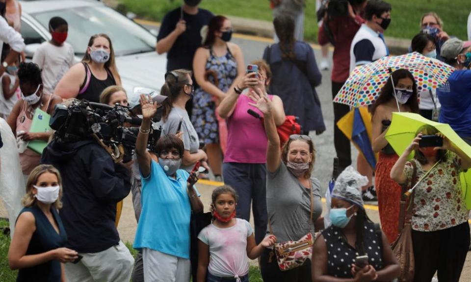 People wait for the candidates’ arrival at Alexis Dupont high school in Wilmington, Delaware.