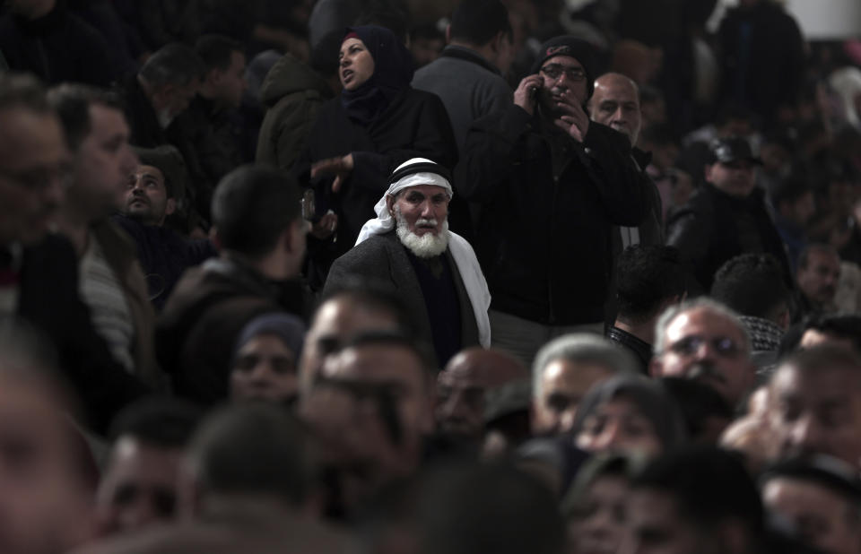 Palestinians wait for their turn to enter the Rafah border crossing with Egypt, in the southern Gaza Strip, Thursday, Feb, 8, 2018. (AP Photo/ Khalil Hamra)