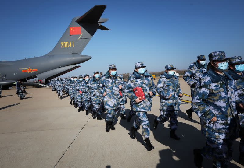 Medical personnel arrive in transport aircraft of the Chinese People's Liberation Army (PLA) Air Force at the Wuhan Tianhe International Airport following the outbreak of the novel coronavirus in Wuhan