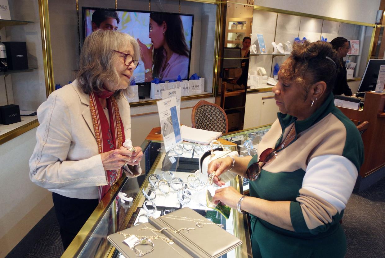 Elizabeth Menard, salesperson for Romm Diamonds in Brockton, works with Patricia Whitlow of Brockton as she goes over a jewelry selection on Thursday, April 25, 2024.