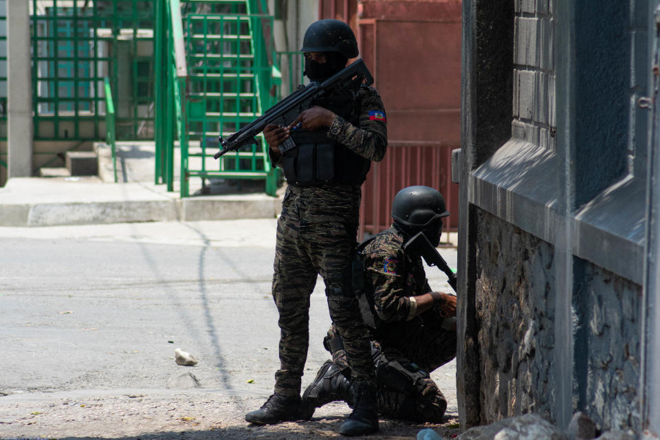 Haitian policemen stand guard on a street corner amid gang violence in Port-au-Prince, Haiti, April 8, 2024.  / Credit: CLARENS SIFFROY/AFP/Getty