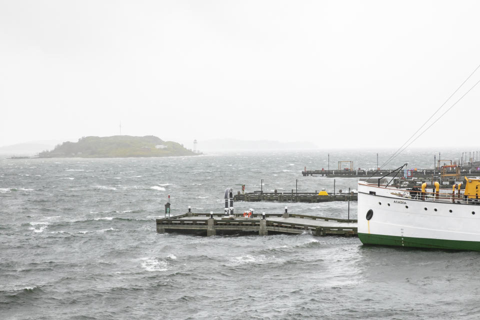 The SS Acadia sits in the Halifax Harbour with Georges Island in the distance at high tide in Halifax, Nova Scotia, on Saturday, Sept. 16, 2023. Severe conditions were predicted across parts of Massachusetts and Maine, and hurricane conditions could hit the Canadian provinces of New Brunswick and Nova Scotia, where the storm, Lee, downgraded early Saturday from hurricane to post-tropical cyclone, was expected to make landfall later in the day. (Kelly Clark /The Canadian Press via AP)