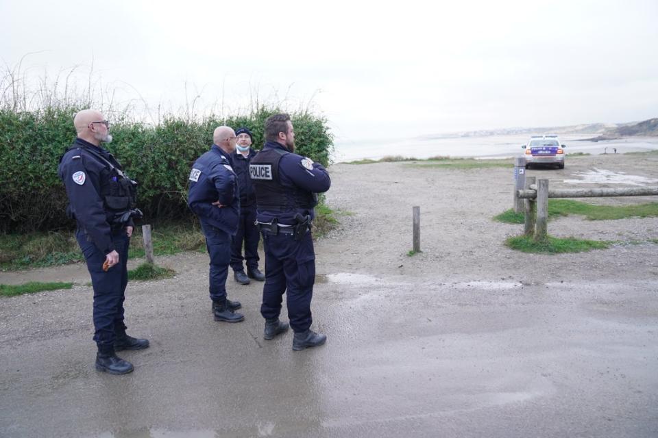 French police look out over the coast at Wimereux, north of Boulogne (Stefan Rousseau/PA) (PA Wire)