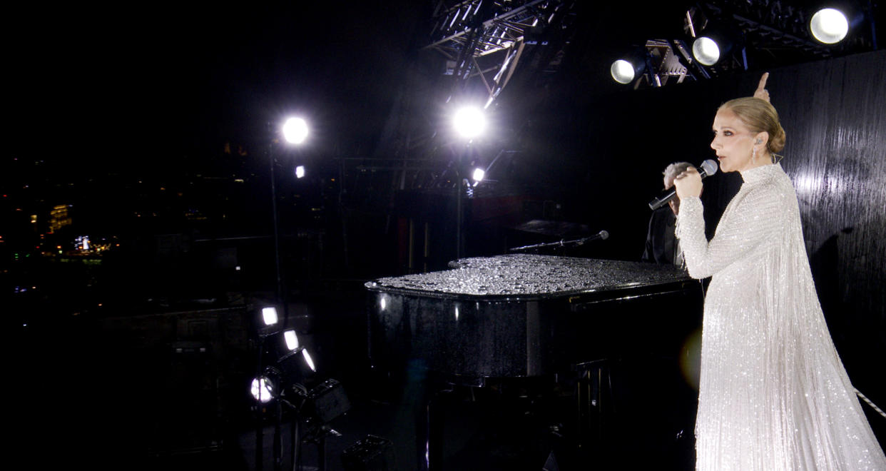 PARIS, FRANCE - JULY 26: (EDITOR'S NOTE: This Handout screengrab was provided by a third-party organization and may not adhere to Getty Images' editorial policy.) This handout released by the Olympic Broadcasting Services, shows a view of singer Celine Dion performing on the Eiffel Tower during the opening ceremony of the Paris 2024 Olympic Games Paris 2024 on July 26, 2024 in Paris, France. (Screengrab by IOC via Getty Images)