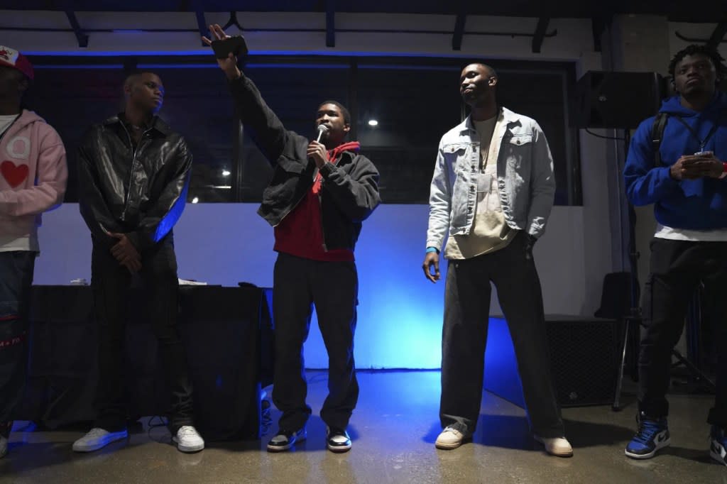 The Cove co-founders, from left, Jonathan Diggs, Jordan Diggs, Darin Starks, Shem Rivera, and Eric Diggs, welcome guests to The Cove, a pop-up, 18-and-up Christian nightclub they started late last year. (AP Photo/Jessie Wardarski)