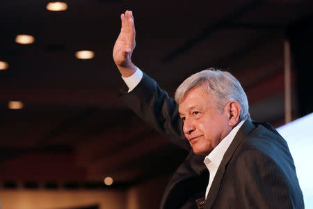 FILE PHOTO: Leftist front-runner Andres Manuel Lopez Obrador of the National Regeneration Movement (MORENA) waves to the audience after a conference organised by the Mexican Construction Industry Association in Guadalajara, Mexico March 23, 2018. REUTERS/Henry Romero