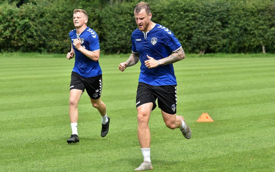 Wheater in training alongside former team-mate Danny Rowe - PA