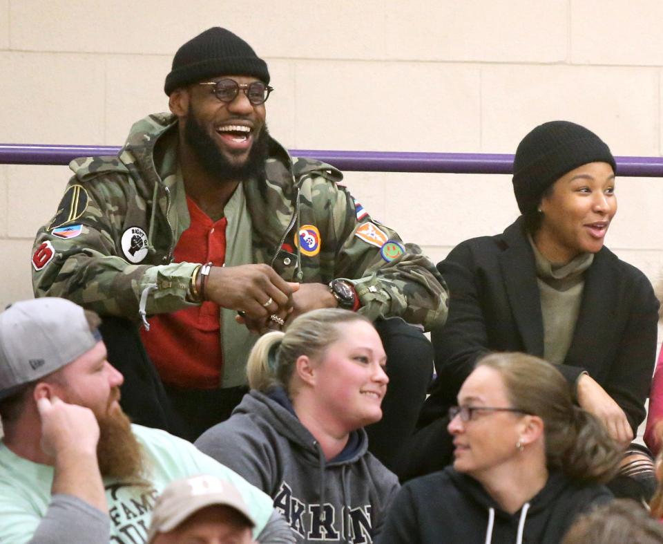 LeBron James, and his wife Savannah, enjoys the McKinley-Jackson girls basketball game at Jackson on Wednesday, Jan. 24, 2018. Future FGCU basketball player Kierstan Bell had 38 points in the win for McKinley.