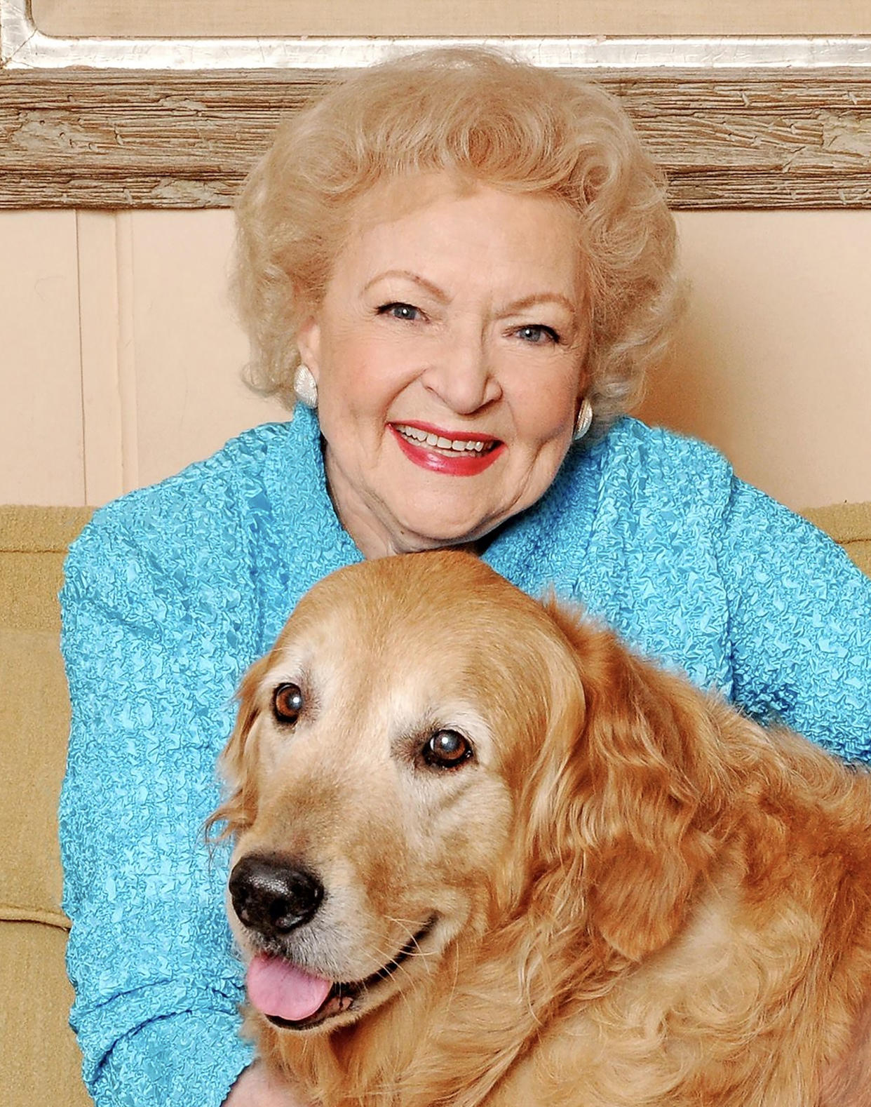 Betty White hugs Pontiac, a golden retriever she acquired from Guide Dogs for the Blind in 2005. (Courtesy Betty White / Guide Dogs for the Blind)