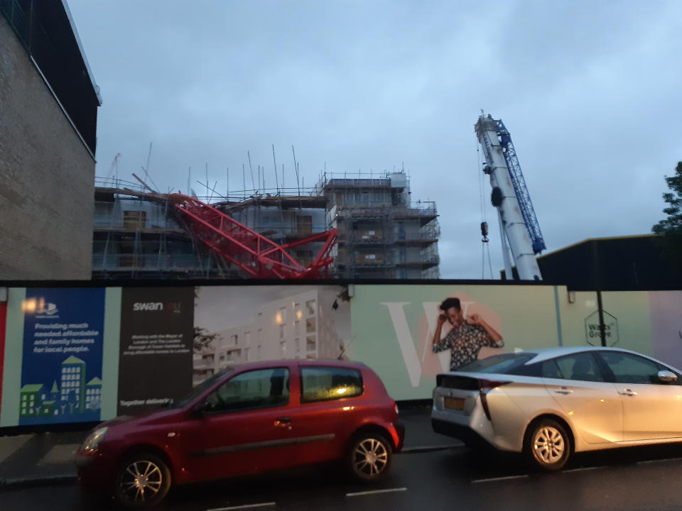 The scene in Bow, east London, where a 20-metre crane has collapsed on to a house leaving people trapped inside.