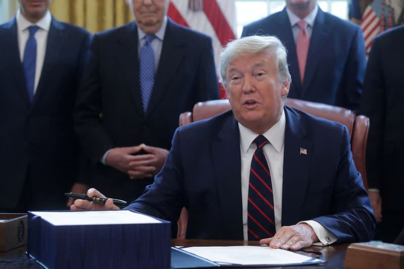 FILE PHOTO: U.S. President Trump hosts coronavirus aid bill signing ceremony at the White House in Washington