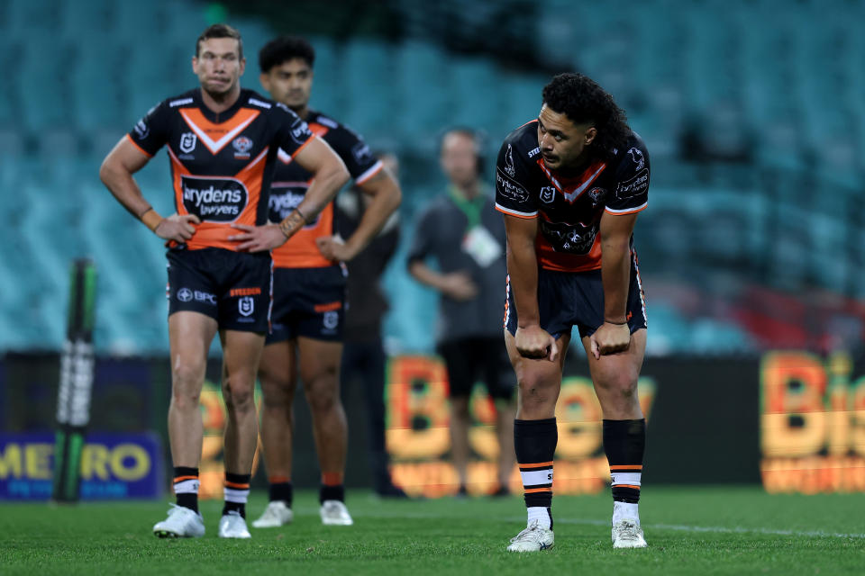 Kelma Tuilagi (pictured right) looks dejected in the Wests Tigers loss.
