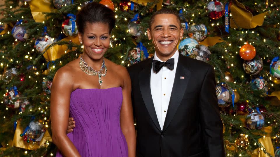 <strong>2009: </strong>President Obama and first lady Michelle Obama in front of the White House Christmas Tree, decorated for the theme "Reflect, Rejoice, Renew." - Everett/Shutterstock