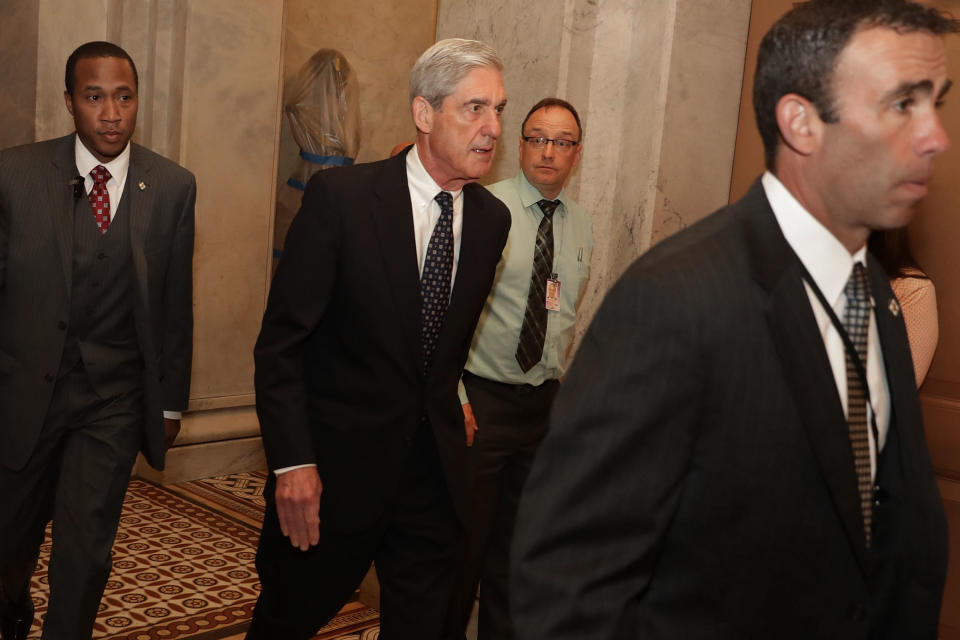 Former FBI Director Robert Mueller is surrounded by security and staff as he leaves a meeting with senators at the U.S. Capitol June 21, 2017 in Washington, DC. Special Counsel overseeing the investigation into Russian interference in the 2016 presidential elections, Mueller was on Capitol Hill to meet with members of the Senate Judiciary Committee. (Photo: Chip Somodevilla/Getty Images)