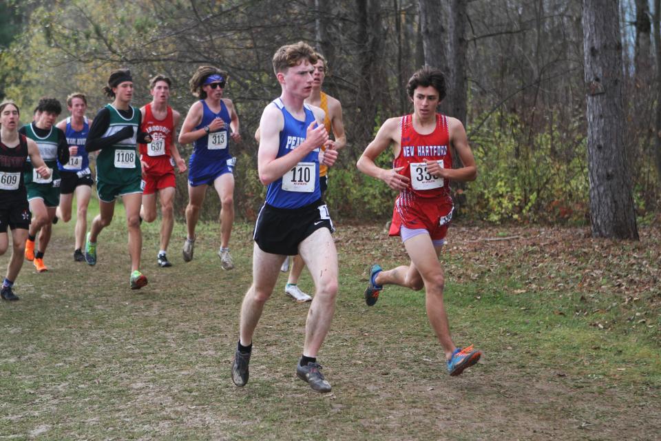 Pearl River's John Hannagan (110) runs in a large pack during the boys Class B state cross-country championship Nov. 11, 2023 in Verona, New York.