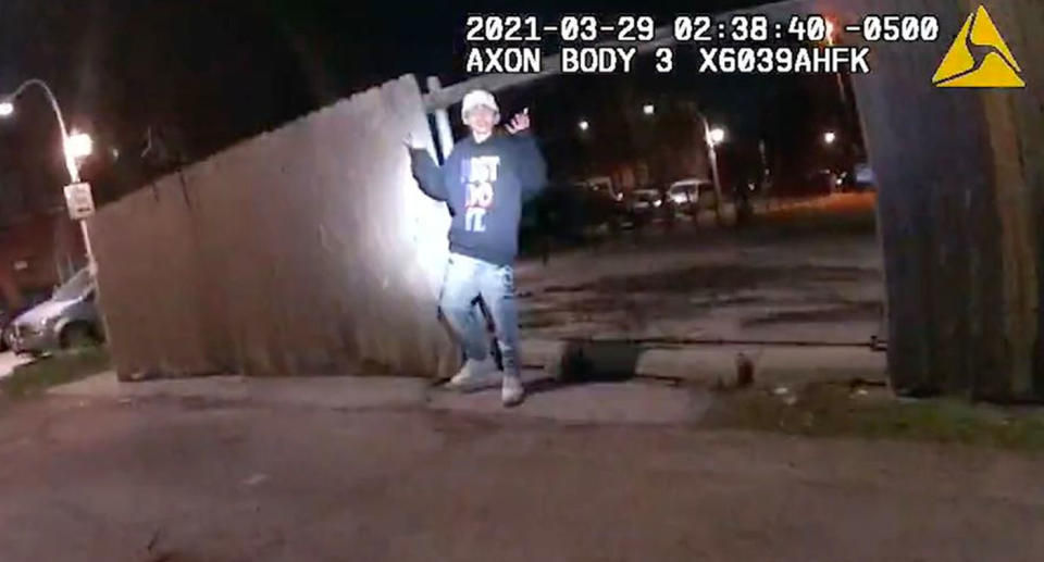 A still from bodycam footage shows Adam Toledo with his hands raised without a weapon in his hand.