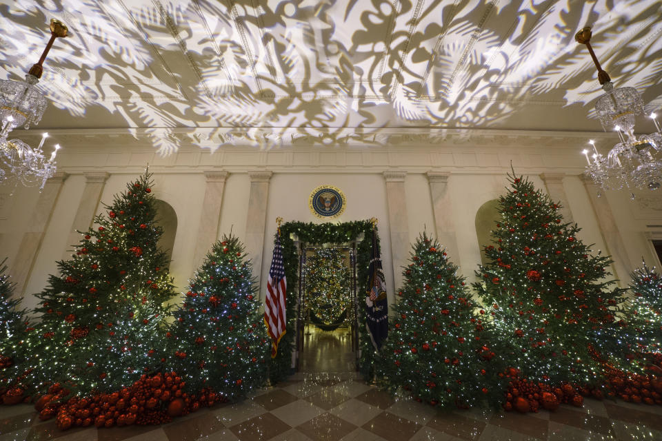 The Grand Foyer and Cross Hall leading into the Blue Room and the official White House Christmas tree are viewed during the 2018 Christmas preview at the White House in Washington, Monday, Nov. 26, 2018. (Photo: Carolyn Kaster/AP)